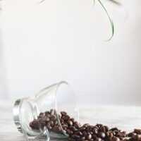 coffee beans spilling out of cup